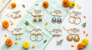 Bright flat lay showcasing a variety of affordable earrings under 500 India, including gold studs, small jhumkas, and oxidised danglers with price tags