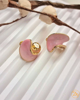 Pink shell-shaped earrings with gold accents on a white background