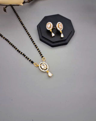 Jewelry set with necklace and earrings on a gray background