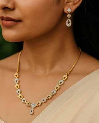Gold necklace and earrings on a model with background