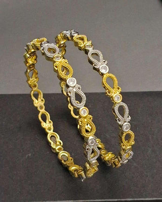 Gold and silver bracelet on a dark background