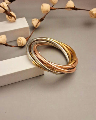 Multicolored bracelet on a neutral background with decorative elements